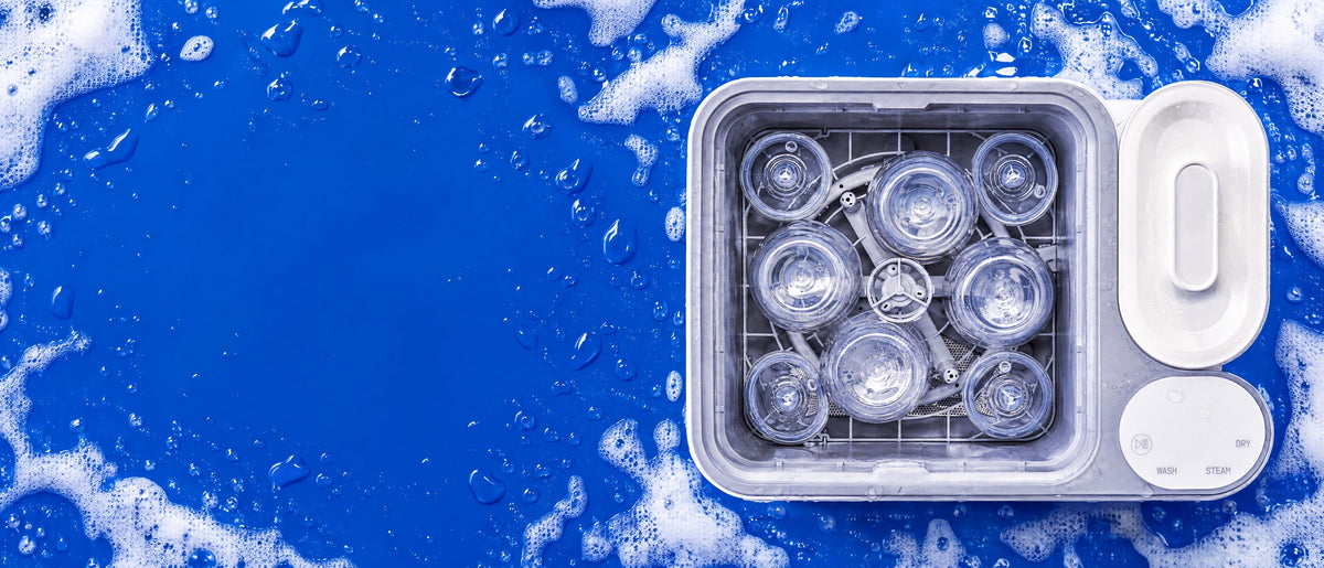 A loaded Clean Max wash basin on cobalt, surrounded by suds.